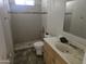 Dilapidated bathroom featuring tiled shower with updated shower head, and single sink vanity at 1843 S Papago Dr, Apache Junction, AZ 85120