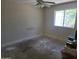 Spacious bedroom featuring a ceiling fan and light fixture, and large window for ample light at 1843 S Papago Dr, Apache Junction, AZ 85120