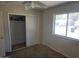 Cozy bedroom features a large closet and a window that provides ample light at 1843 S Papago Dr, Apache Junction, AZ 85120