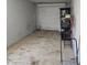 Attached garage with roll up door. Concrete floor and good lighting at 1843 S Papago Dr, Apache Junction, AZ 85120