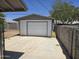 Garage featuring a large door and a concrete surrounding, and block wall at 1843 S Papago Dr, Apache Junction, AZ 85120