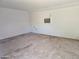 Empty garage featuring an air conditioning unit for potential storage or workspace at 1843 S Papago Dr, Apache Junction, AZ 85120
