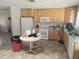 Spacious kitchen featuring a full suite of appliances, wooden cabinets, and ample counter space at 1843 S Papago Dr, Apache Junction, AZ 85120