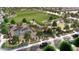A fantastic bird's eye view of the neighborhood park featuring a basketball court, beach volleyball court, and grassy field at 18941 W Monterosa St, Litchfield Park, AZ 85340