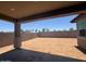Spacious backyard with block fencing, offering privacy and a blank canvas for landscaping ideas at 18941 W Monterosa St, Litchfield Park, AZ 85340