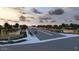 Scenic view of the Enclave community entrance, featuring manicured landscaping and a welcoming atmosphere at 18941 W Monterosa St, Litchfield Park, AZ 85340