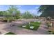 The community park has a splash of fun with cornhole boards, picnic benches, and lush landscaping for a scenic view at 18941 W Monterosa St, Litchfield Park, AZ 85340