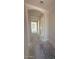 Unfinished hallway showcasing an arched ceiling and grey concrete floors at 18941 W Monterosa St, Litchfield Park, AZ 85340