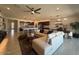 Living room with open floor plan to kitchen, stainless appliances, dining area and modern design at 18941 W Monterosa St, Litchfield Park, AZ 85340