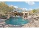 Large community pool surrounded by mature landscaping and comfortable lounging areas at 25150 N Windy Walk Dr # 14, Scottsdale, AZ 85255