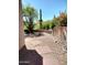 Desert landscaped courtyard with gravel, cacti, stepping stones and blooming bougainvillea at 25150 N Windy Walk Dr # 14, Scottsdale, AZ 85255