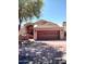 Charming single-story home featuring a two-car garage, desert landscaping, and inviting curb appeal at 25150 N Windy Walk Dr # 14, Scottsdale, AZ 85255