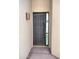 Contemporary front door with sleek design and sidelight, enhancing curb appeal and natural light at 25150 N Windy Walk Dr # 14, Scottsdale, AZ 85255