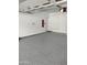 Clean, empty garage featuring a sealed floor, storage, and access to the house at 25150 N Windy Walk Dr # 14, Scottsdale, AZ 85255