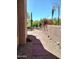 Stone walkway, lush landscaping and vibrant flowers create a tranquil outdoor space at 25150 N Windy Walk Dr # 14, Scottsdale, AZ 85255