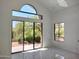 Living room with large windows and a door, providing natural light and great desert views at 25150 N Windy Walk Dr # 14, Scottsdale, AZ 85255