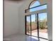 Bright living room with a large window, offering lots of natural light and desert views at 25150 N Windy Walk Dr # 14, Scottsdale, AZ 85255