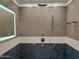 Modern shower with a rain shower head, handheld wand, and sleek tile for a spa-like experience at 25150 N Windy Walk Dr # 14, Scottsdale, AZ 85255