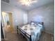 Bedroom showcasing a ceiling fan and access to another room at 26243 W Wahalla Ln, Buckeye, AZ 85396