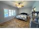 Bedroom with shuttered windows and a view of the backyard pool at 26243 W Wahalla Ln, Buckeye, AZ 85396