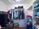 Spacious walk-in closet with ample hanging space and shelving for organization at 26243 W Wahalla Ln, Buckeye, AZ 85396