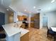 Bright kitchen features stainless steel appliances, wood cabinets, and tile flooring at 26243 W Wahalla Ln, Buckeye, AZ 85396