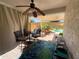 Cozy covered patio with outdoor seating overlooking the refreshing swimming pool at 26243 W Wahalla Ln, Buckeye, AZ 85396