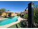 Inviting backyard pool features a convenient outdoor shower at 26243 W Wahalla Ln, Buckeye, AZ 85396