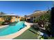 Gorgeous pool with lush landscaping, patio, and desert plants at 26243 W Wahalla Ln, Buckeye, AZ 85396