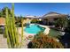 Wonderful pool surrounded by lush landscaping and a covered patio at 26243 W Wahalla Ln, Buckeye, AZ 85396