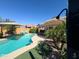 Inviting pool with an umbrella, perfect for summer days at 26243 W Wahalla Ln, Buckeye, AZ 85396