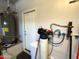 Utility room features a water heater, water softener, and exterior access door at 26243 W Wahalla Ln, Buckeye, AZ 85396