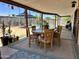 Cozy covered patio with dining set, plants, and a view of the refreshing pool at 2719 W Carter Dr, Tempe, AZ 85282