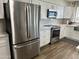 Modern kitchen featuring stainless steel appliances and white cabinets at 2719 W Carter Dr, Tempe, AZ 85282
