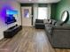 Living room features a large sectional and a flat screen television at 2719 W Carter Dr, Tempe, AZ 85282