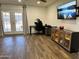 Spacious living room featuring wood floors, entertainment center and french doors to the exterior at 2719 W Carter Dr, Tempe, AZ 85282
