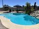 Inviting pool with lush tropical plants and rock detail, perfect for outdoor enjoyment at 2719 W Carter Dr, Tempe, AZ 85282