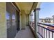 A covered balcony with railings and stone pillars, offering views of the community at 2725 E Mine Creek Rd # 2146, Phoenix, AZ 85024