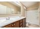 Bathroom featuring double sinks, ample counter space, and a shower-tub combo at 2725 E Mine Creek Rd # 2146, Phoenix, AZ 85024