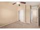 Cozy bedroom with a ceiling fan, carpet, and walk-in closet at 2725 E Mine Creek Rd # 2146, Phoenix, AZ 85024