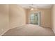Bedroom featuring a ceiling fan, sliding glass doors to a balcony, and neutral carpeting at 2725 E Mine Creek Rd # 2146, Phoenix, AZ 85024