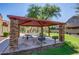 Community picnic area with stone columns, picnic tables, and playground nearby at 2725 E Mine Creek Rd # 2146, Phoenix, AZ 85024