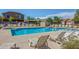 Sparkling community pool with lounge chairs and lush landscaping at 2725 E Mine Creek Rd # 2146, Phoenix, AZ 85024