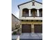 Inviting two-story townhome with a private balcony, beautiful stonework, and two-car garage at 2725 E Mine Creek Rd # 2146, Phoenix, AZ 85024