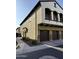 Two-story townhome boasts a private balcony, stone accents, and convenient two-car garage at 2725 E Mine Creek Rd # 2146, Phoenix, AZ 85024