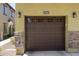 A charming brown garage door with windows at 2146 at 2725 E Mine Creek Rd # 2146, Phoenix, AZ 85024