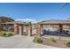 Community pool area with iron gate, stone pillars, covered seating, and manicured landscaping at 2725 E Mine Creek Rd # 2146, Phoenix, AZ 85024