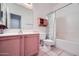 Full bathroom featuring a single sink vanity, a mirrored cabinet, and a shower-tub combo at 2729 N Kenton St, Mesa, AZ 85215