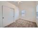 Bright bedroom features a ceiling fan and a window with blinds at 2729 N Kenton St, Mesa, AZ 85215