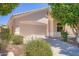 Charming home featuring a neutral stucco facade, a two-car garage, and well-maintained desert landscaping at 2729 N Kenton St, Mesa, AZ 85215